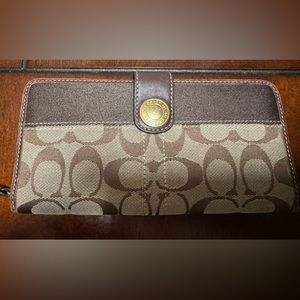 Coach Accordion Zip Wallet in Brown Signature Canvas.
